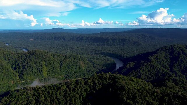 Wide Aerial View of Tropical Rainforest Valley in Ecuador with Green Mountain Slopes, Distant Horizon and Remote Andean Amazon Nature Scene