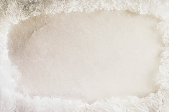White textured background with soft edges, suitable for various design uses