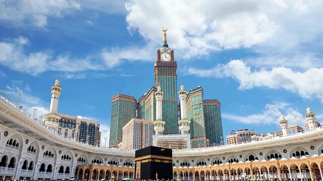 Kaaba at Masjid al Haram in Mecca with Makkah Royal Clock Tower and Golden Islamic Calligraphy. Kaaba
Mecca
The Holy Kaaba in Masjid al-Haram, Mecca, Saudi Arabia