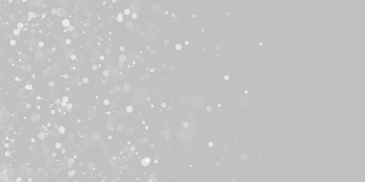 Floating white bokeh orbs create a scattered particle effect. The circles vary in size and opacity across a dark background. This glowing pattern mimics dust or snow for creative overlays.