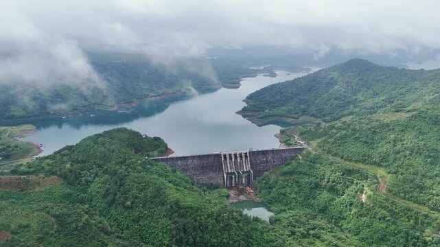 Aerial view of Ta Dung Lake with green hills and Dam. Dak Nong, central Vietnam.