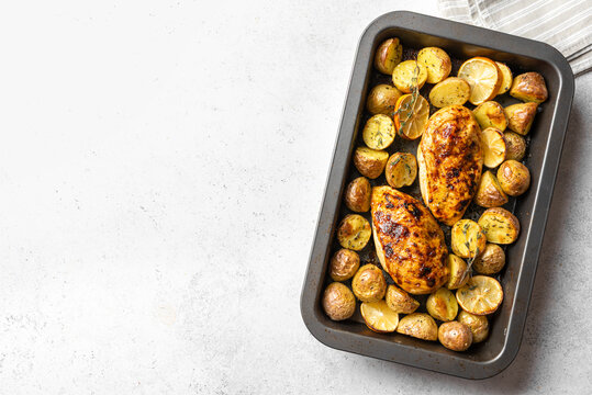 Oven roasted lemon garlic chicken and baby potatoes with herbs
