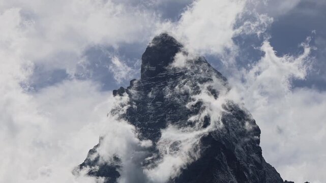 Matterhorn with small clouds circling around the moutain top