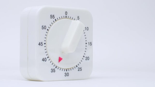 Time lapse of a kitchen clock timer countdown to zero.