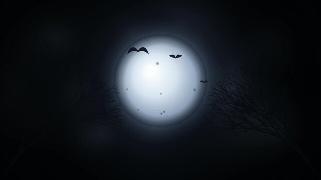 Silhouettes of flying bats against a large glowing full moon in the dark night sky with silhouettes of bare tree branches on the sides creating a spooky halloween atmosphere 4k Motion Video