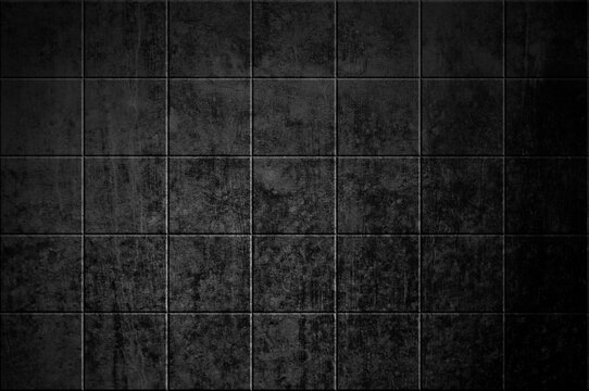 Fliesenwand mit schwarzen Fliesen als Hintergrund