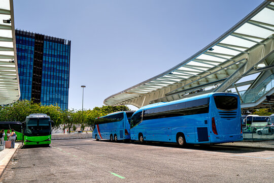Buses at the Oriente bus station in Lisbon with tourists, Portugal