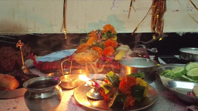 Hindu Puja Altar with Marigold Flowers, Diya Lamp and Traditional Offerings