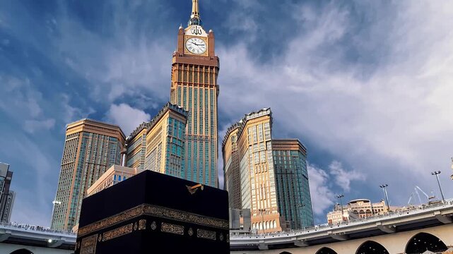 Kaaba at Masjid al Haram in Mecca with Makkah Royal Clock Tower and Golden Islamic Calligraphy. Kaaba
Mecca
The Holy Kaaba in Masjid al-Haram, Mecca, Saudi Arabia
