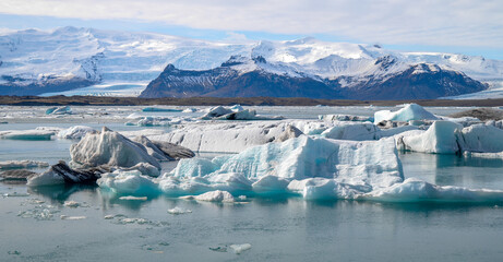 Glacier Lagoon with Icebergs and Snow-Capped Mountains in Iceland © Sonja