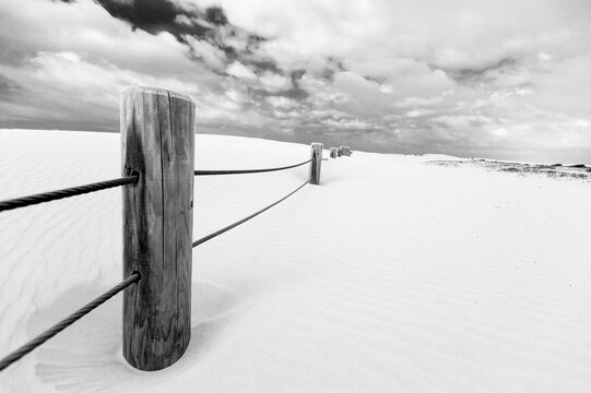 Sand dune and  picket fence at Stockton Beach Newcastle Australia