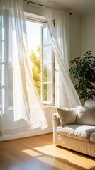 Naklejka premium Bright sunlight shines through sheer white curtains in open window. Cozy living room features comfy sofa, large green indoor plant. Warm daylight illuminates hardwood floor, modern interior decor.