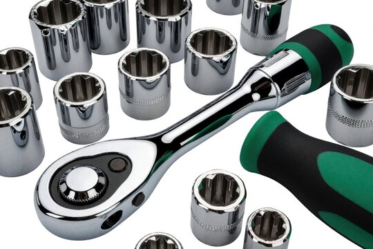 Chrome plated ratchet wrench and socket kit on white background. Pro automotive repair tools for mechanical work. Shiny metal hardware for fixing nuts bolts.