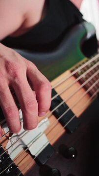 Macro Fretboard View of Bass Guitar Fretting Hand
