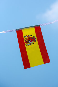 Spanish national flag waving in the wind, representing Spain&rsquo;s National Day, Fiesta Nacional de Espa&ntilde;a, national pride and Spanish identity. Red and yellow Rojigualda flag suitable for patriotic celeb