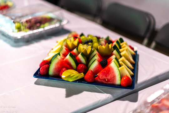 Fresh fruit platter with watermelon, strawberries, kiwi, and pineapple