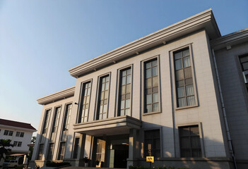 Obraz premium Institutional architecture and government building, public administration and civic infrastructure, classic stone facade with tall windows at sunset