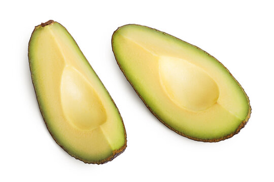 avocado pieces isolated on white background close up. Top view. Flat lay