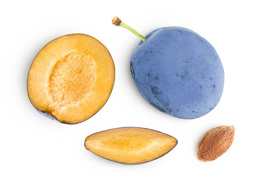 fresh blue plum with half and slices isolated on white background. Top view. Flat lay