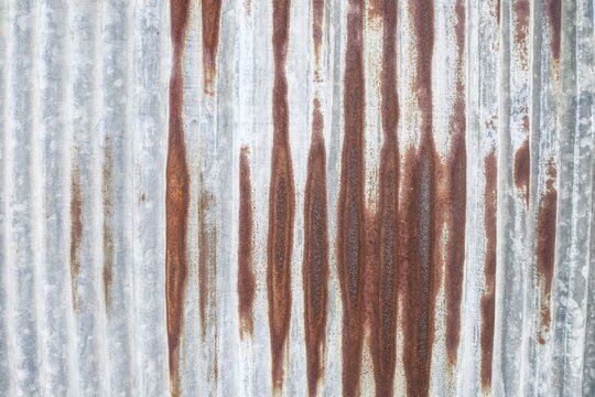 Corrugated galvanized iron sheet with rust texture background