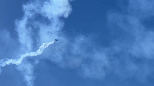 Stunt Plane Performing Aerobatics with Smoke Trail in Gold Coast