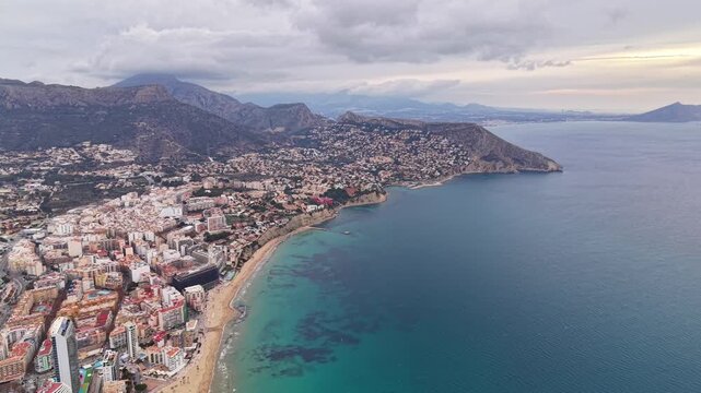 Aerial Family Beach Resort Along Curved Bay, Broad Sandy Beach, Boardwalk, Hotels, Turquoise Shallows,