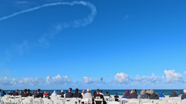 Beach Crowd Watching Airshow with Smoke Trails in Surfers Paradise
