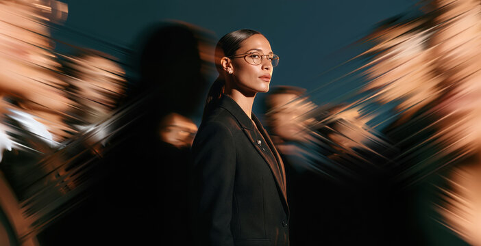 Confident Business Leader With Glasses Standing Out Amid Abstract Crowd Motion