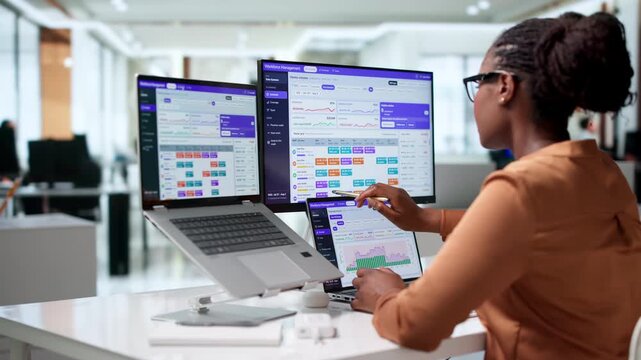 Young African American Woman Manager Plans Employee Shifts