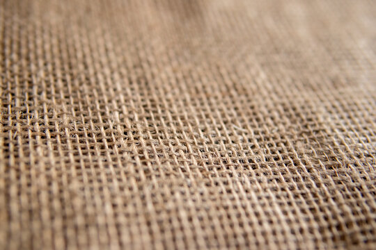 Natural burlap fabric texture with woven fibers