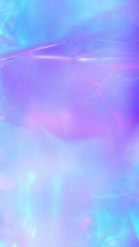 Holographic Christmas glowing background. Colorful motion abstract pink purple blue light