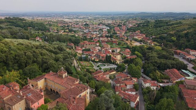 Aerial view of the medieval italian village of Collodi, home of Pinocchio. Ancient houses with red roofs nestled among green hills