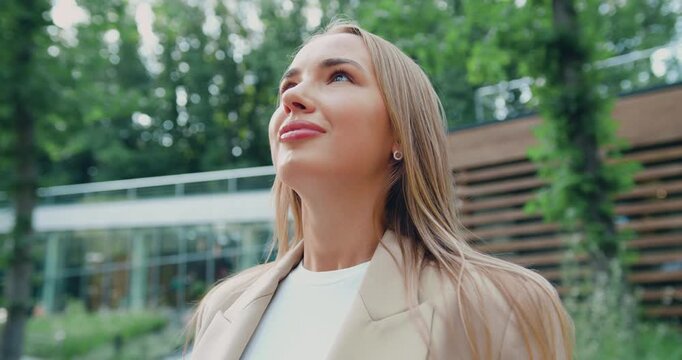 Portrait of young beautiful blonde woman inhaling and exhaling fresh air, taking deep breath, reducing stress and looking with smile, enjoy freedom and life. Healthy lifestyle concept