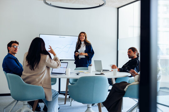 Team presents user research findings in meeting