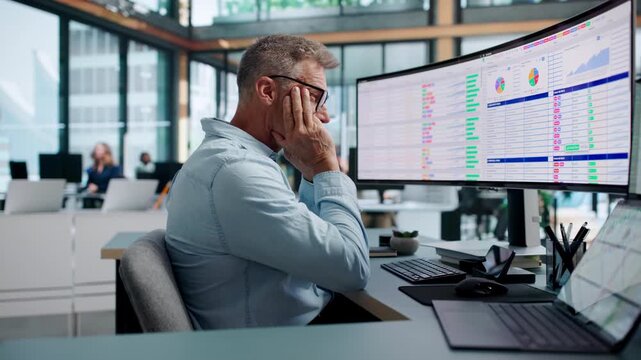 Chartered Accountant Tiredly Reviewing Complex Billing Codes