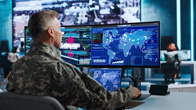 Commander Carefully Studies World Map On Computer
