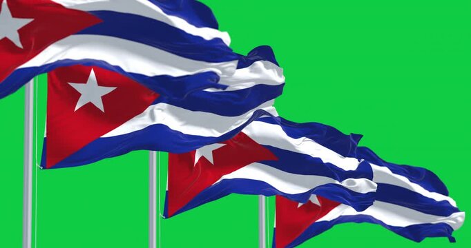 National flags of Cuba waving in the wind isolated on green background