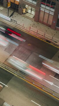 Vehicles travel quickly along a city street at night, with blurred lights creating a dynamic urban scene. Time-lapse, Seoul, South Korea