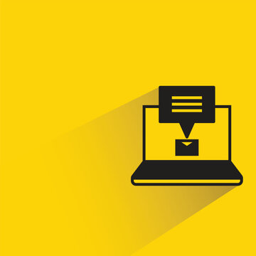 email message in laptop icon drop shadow on yellow background
