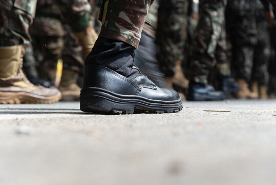 Soldiers Black Combat Boot on the Asphalt