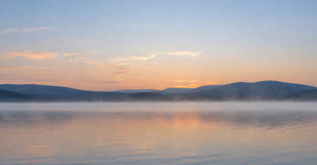 Fototapeta premium Morning mist drifting over a calm lake at pastel dawn