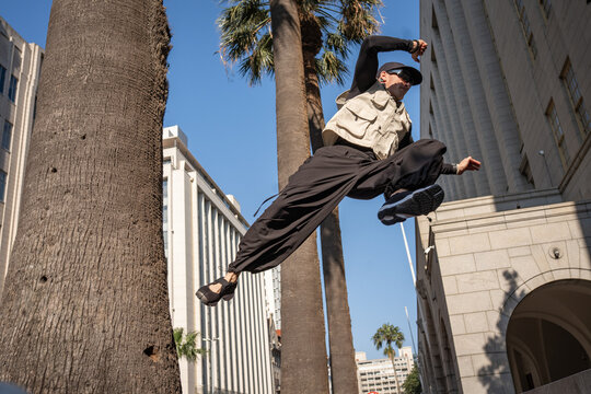 action shot of a parkour athlete in the city