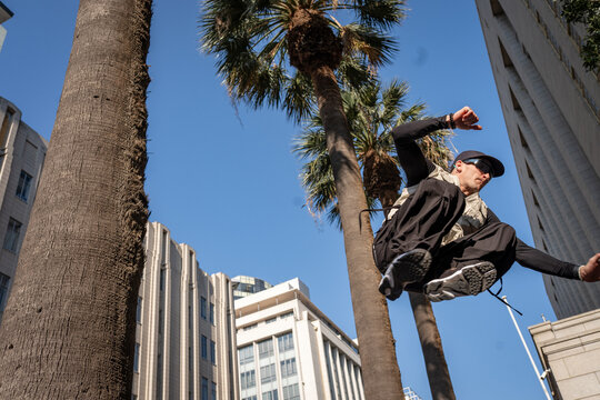 action shot of a parkour athlete in the city