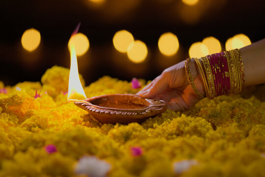 Clay diya lamps lit during diwali celebration, Diwali, or Deepavali, is India's biggest and most important holiday.