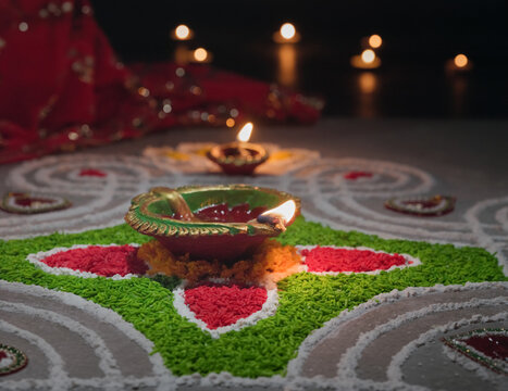 Clay diya lamps lit during diwali celebration, Diwali, or Deepavali, is India's biggest and most important holiday.