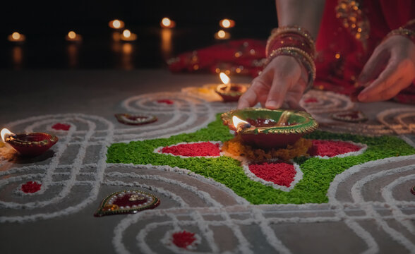 Clay diya lamps lit during diwali celebration, Diwali, or Deepavali, is India's biggest and most important holiday.