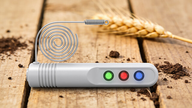IoT soil sensor on wooden surface with wheat grains and soil nearby for smart farming