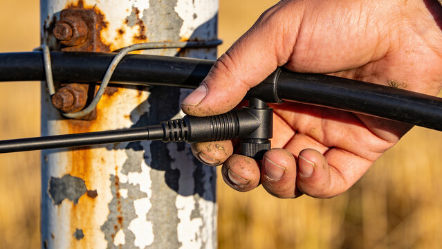Connecting a soil moisture sensor to a field setup for smart farming in agriculture