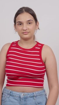 Vertical Shot of Indian Teenage Girl Greeting Adab