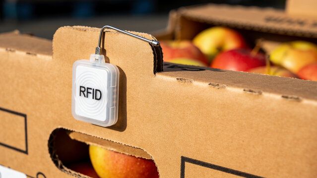 RFID tag attached to a box of apples that shows the role of technology in agriculture